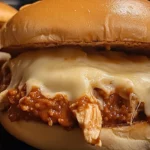 Close-up cheesy chicken sloppy joe sandwich